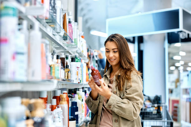 is your skincare actually clean - woman checking skincare product label